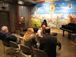 Nelly Jones sings and plays music for the open.