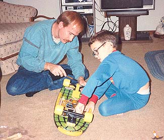 Philip Wyatt and Father Terry with Philip's First Skateboard