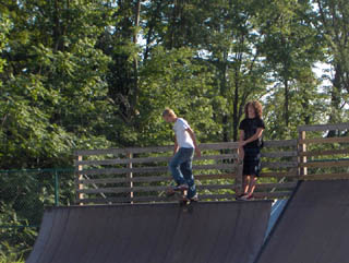 Skater starting down ramp